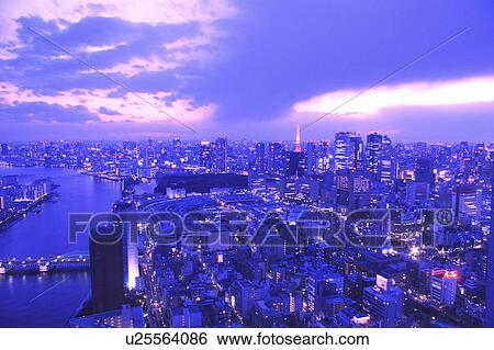 Stock Photograph - Cityscape in the evening, long exposure, Tokyo Tower, Tokyo prefecture, Japan. Fotosearch