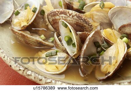 Stock Photo - Clams steamed by sake. Fotosearch