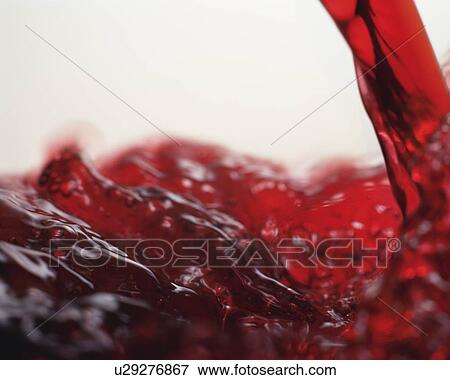 Stock Photo - Close Up Image of Poured Red Wine. Fotosearch