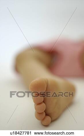 Close-up of baby girl's foot View Large Photo Image Stock Image - Close-up of baby girl's foot. Fotosearch