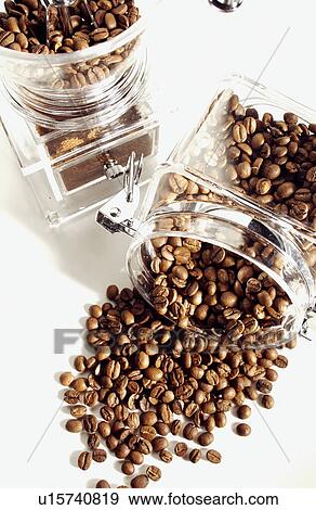 Coffee beans in bottles, white background View Large Photo Image Stock Photo - Coffee beans in bottles, white background. Fotosearch