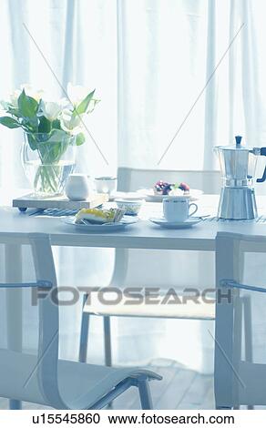 Stock Image - Coffee cup, tart on table. Fotosearch