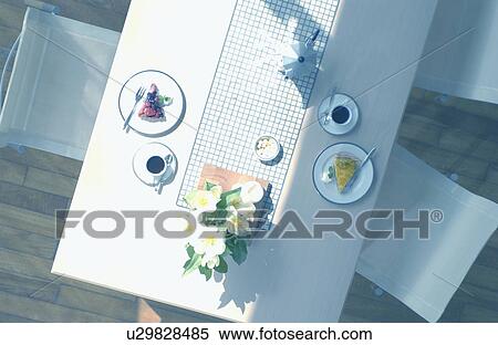 Coffee cup, tart on table View Large Photo Image Stock Photography - Coffee cup, tart on table. Fotosearch