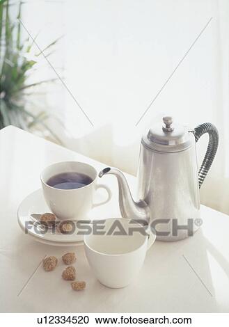 Coffee pot and cups on table View Large Photo Image Stock Image - Coffee pot and cups on table. Fotosearch