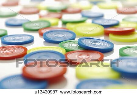 Stock Photo - Colorful Plastic Coins. Fotosearch