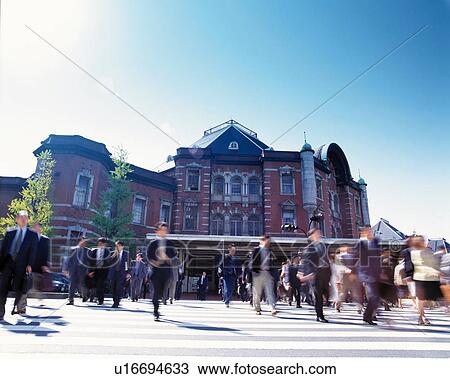 Stock Image - Commuters from Tokyo train station, Japan. Fotosearch