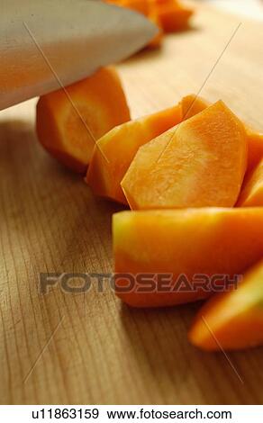 Stock Photo - Copping carrots. Fotosearch