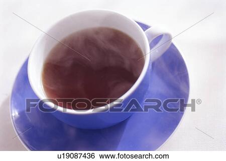 Stock Photograph - Cup of coffee, close up, white background. Fotosearch