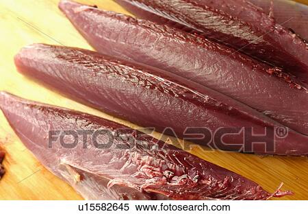 Cut bonito on cutting board, close up View Large Photo Image Stock Photography - Cut bonito on cutting board, close up. Fotosearch