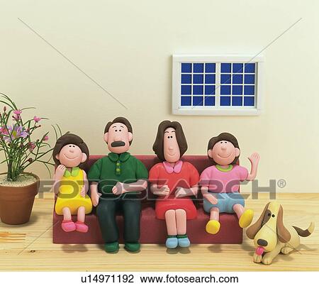 Stock Image - Family and dog, made of clay. Fotosearch