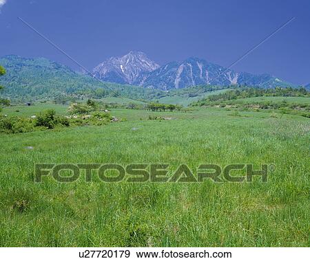 Stock Photo - Field and Mt. Yatsugatake. Fotosearch