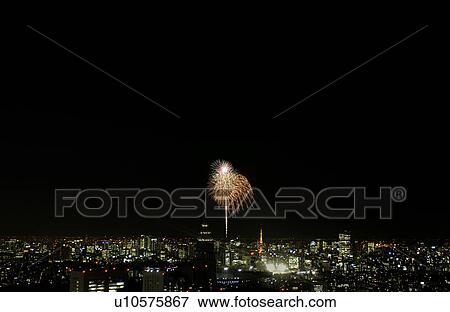 Stock Photo - Fireworks over city skyline, Tokyo Prefecture, Japan. Fotosearch