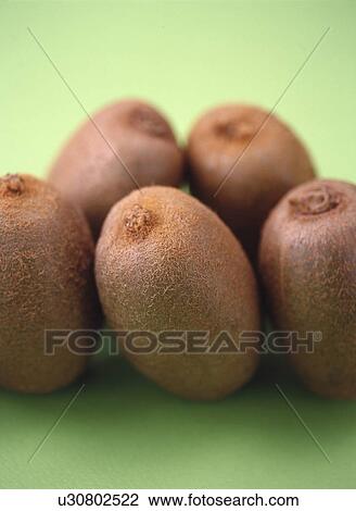 Five kiwi fruits, green background View Large Photo Image Stock Image - Five kiwi fruits, green background. Fotosearch