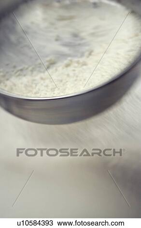 Flour being sifted, blurred motion View Large Photo Image Stock Image - Flour being sifted, blurred motion. Fotosearch