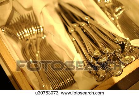 Forks and table knives in box, close up View Large Photo Image Stock Image - Forks and table knives in box, close up. Fotosearch
