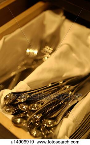 Forks and table knives in box, close up View Large Photo Image Stock Photo - Forks and table knives in box, close up. Fotosearch