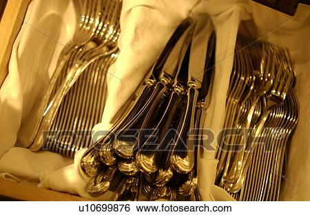 Forks and table knives in box, close up View Large Photo Image Stock Photograph - Forks and table knives in box, close up. Fotosearch