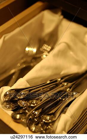 Stock Photograph - Forks and table knives in box, close up. Fotosearch