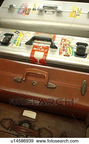 Stock Photo - Four suitcases, close up. Fotosearch