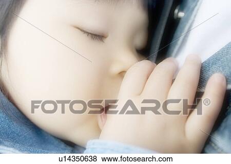 Girl sucking thumb, sleeping, close up, soft focus View Large Photo Image Stock Photo - Girl sucking thumb, sleeping, close up, soft focus. Fotosearch