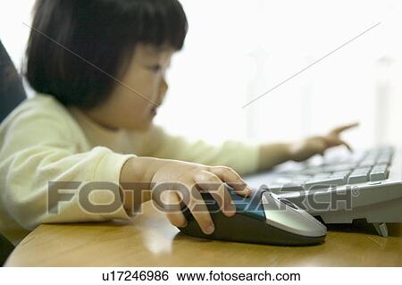 Stock Photograph - Girl using computer. Fotosearch