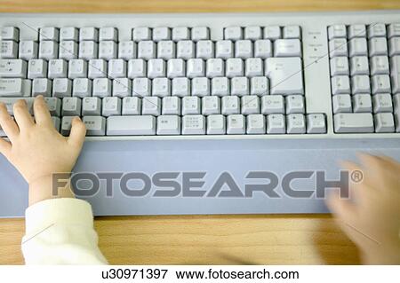 Girl using computer, touching keyboard, blurred motion View Large Photo Image Stock Photo - Girl using computer, touching keyboard, blurred motion. Fotosearch