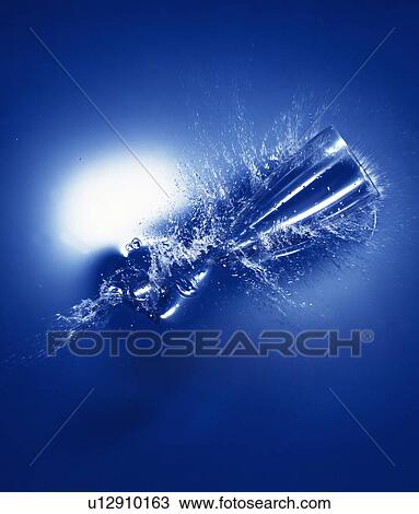 Glass dropped on water, blue background View Large Photo Image Stock Image - Glass dropped on water, blue background. Fotosearch