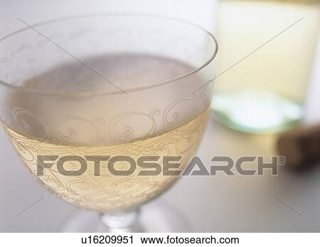 Glass of white wine, close up View Large Photo Image Stock Image - Glass of white wine, close up. Fotosearch