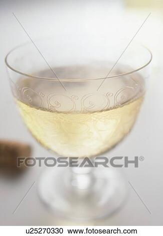 Glass of white wine, close up View Large Photo Image Stock Image - Glass of white wine, close up. Fotosearch