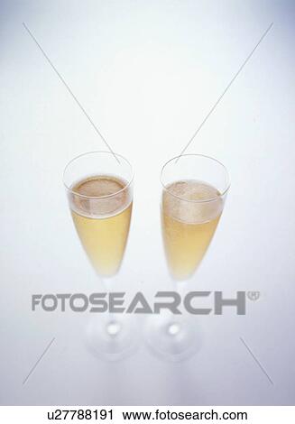 Glasses of champagne, white background View Large Photo Image Stock Image - Glasses of champagne, white background. Fotosearch