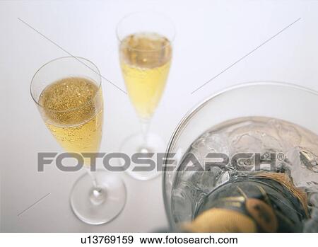 Stock Photo - Glasses of champagne, white background. Fotosearch