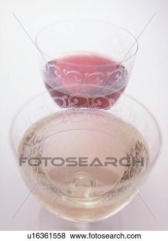 Glasses of red and white wine, close up, white background View Large Photo Image Stock Photo - Glasses of red and white wine, close up, white background. Fotosearch