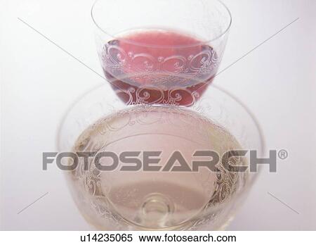 Stock Photography - Glasses of red and white wine, close up, white background. Fotosearch