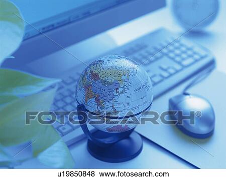 Stock Photo - Globe on desk, toned image. Fotosearch