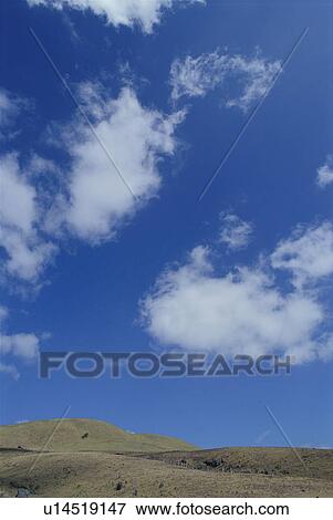 Hill and blue sky View Large Photo Image Stock Photo - Hill and blue sky. Fotosearch