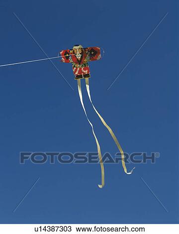 Kite in the sky, blue background View Large Photo Image Stock Image - Kite in the sky, blue background. Fotosearch