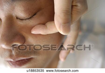 Man getting Shiatsu on his face View Large Photo Image Stock Photography - Man getting Shiatsu on his face. Fotosearch
