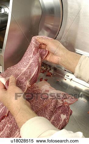 Man using meat slicer, holding a slice of meat View Large Photo Image Stock Photography - Man using meat slicer, holding a slice of meat. Fotosearch