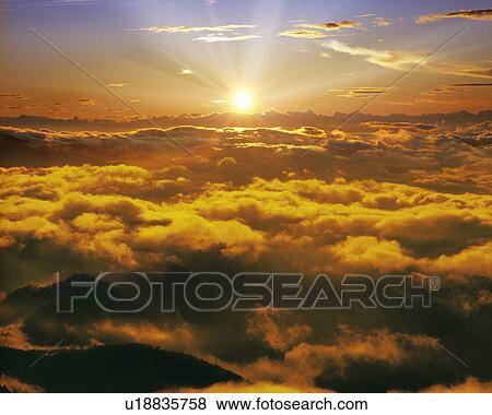 Morning Sun Over the Clouds View Large Photo Image Stock Photo - Morning Sun Over the Clouds. Fotosearch