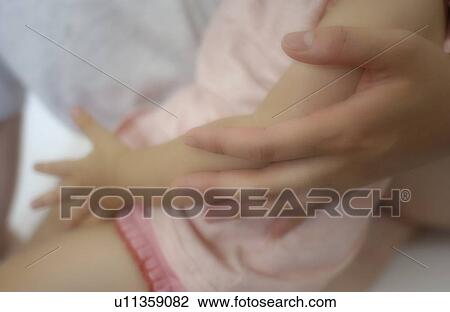 Mother holding a baby girl View Large Photo Image Stock Image - Mother holding a baby girl. Fotosearch