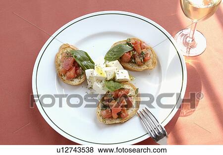 Mozzarella cheese and tomato on bruschetta and white wine View Large Photo Image Stock Photo - Mozzarella cheese and tomato on bruschetta and white wine. Fotosearch