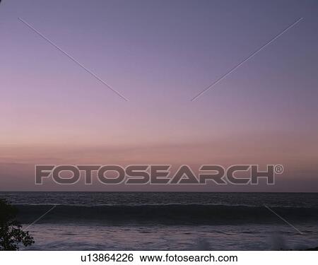 Ocean at dusk View Large Photo Image Stock Photograph - Ocean at dusk. Fotosearch