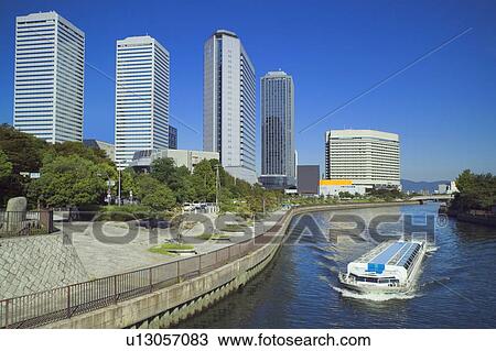 Office buildings and boat on river, Osaka city, Osaka prefecture, Japan View Large Photo Image Stock Image - Office buildings and boat on river, Osaka city, Osaka prefecture, Japan. Fotosearch