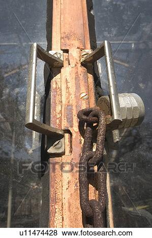 Padlock and chain on door View Large Photo Image Stock Photo - Padlock and chain on door. Fotosearch