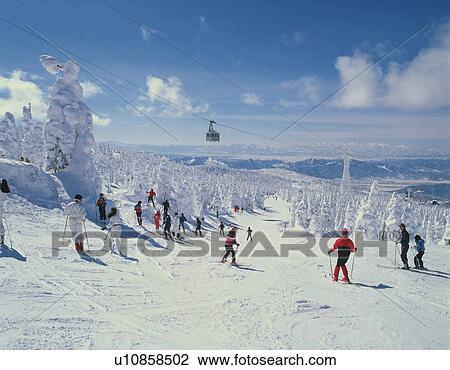 Stock Image - People skiing in mountain, Yamagata city, Yamagata prefecture, Japan. Fotosearch