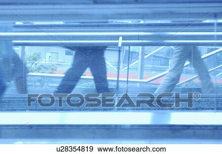 People walking down the passage, toned image View Large Photo Image Stock Photo - People walking down the passage, toned image. Fotosearch