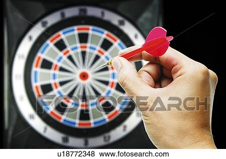 Person playing dart View Large Photo Image Stock Photo - Person playing dart. Fotosearch
