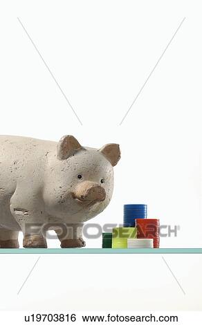 Pig figurine and toy coins View Large Photo Image Stock Photograph - Pig figurine and toy coins. Fotosearch