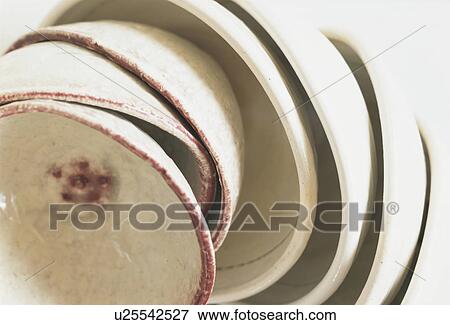 Pile of bowls, close up, white background View Large Photo Image Stock Photo - Pile of bowls, close up, white background. Fotosearch