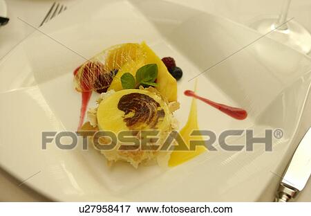 Stock Photo - Plate of citrus fruits terrine, close up. Fotosearch